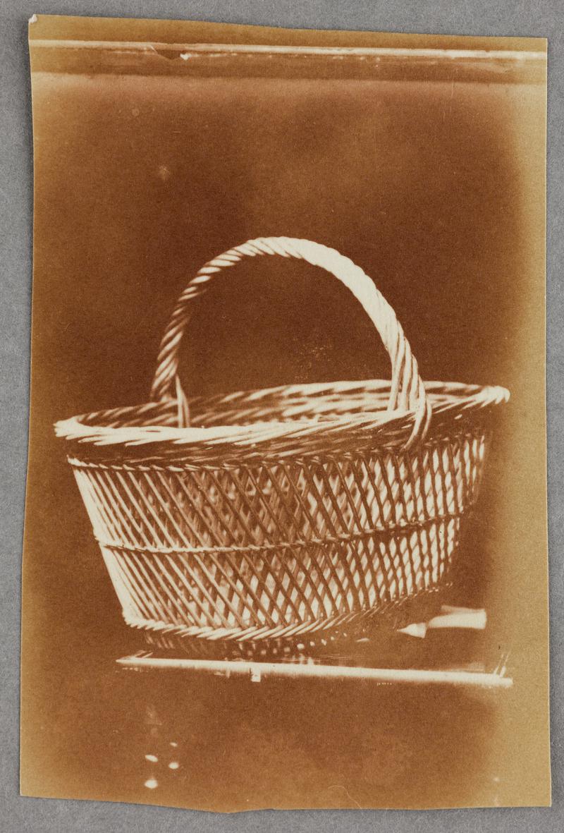 large basket on table, photograph
