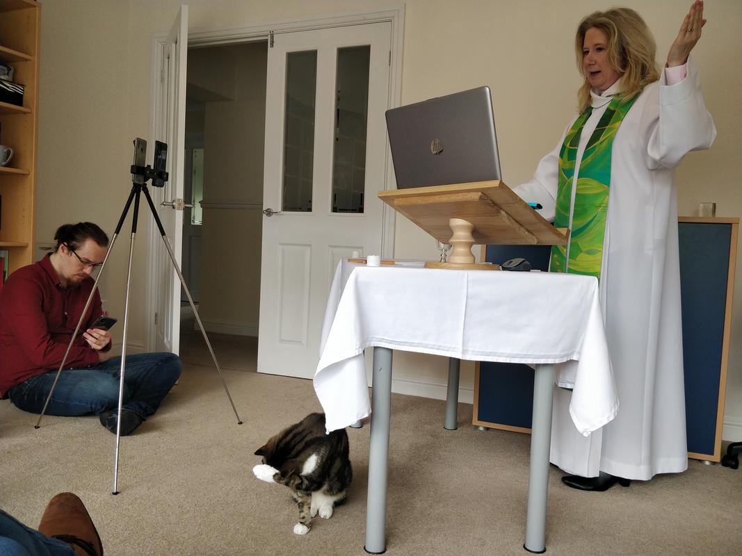 Reverend Suzanne Brumwell preaching at a virtual church.