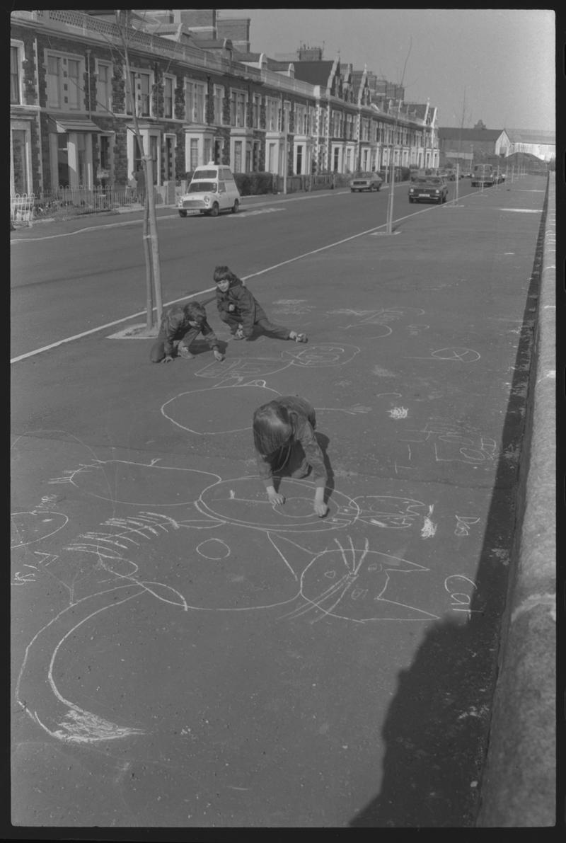 Children playing on pavement at Windsor Esplanade, Butetown.