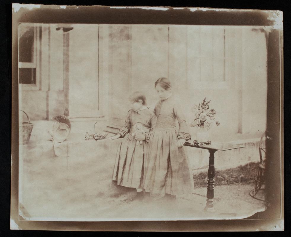 Two girls in front of porch at Penllergaer