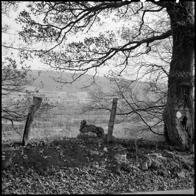 Black and white film negative showing a distant view of Abernant Colliery.  'Abernant' is transcribed from original negative bag.