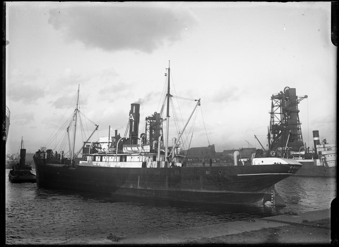 Three quarter Port stern view of S.S. DOURO and tug, c.1936.