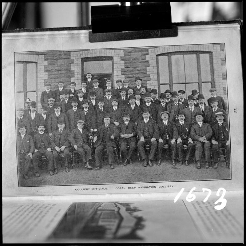 Black and white film negative of a photograph showing a group of 'Colliery Officials, Ocean Deep Navigation Colliery'.
