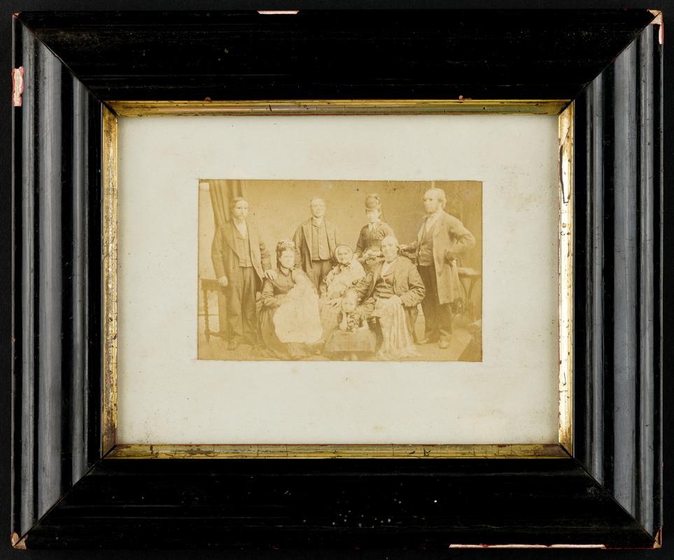 Photograph of family group : 4 men, 3 women, 1 child, 1 baby