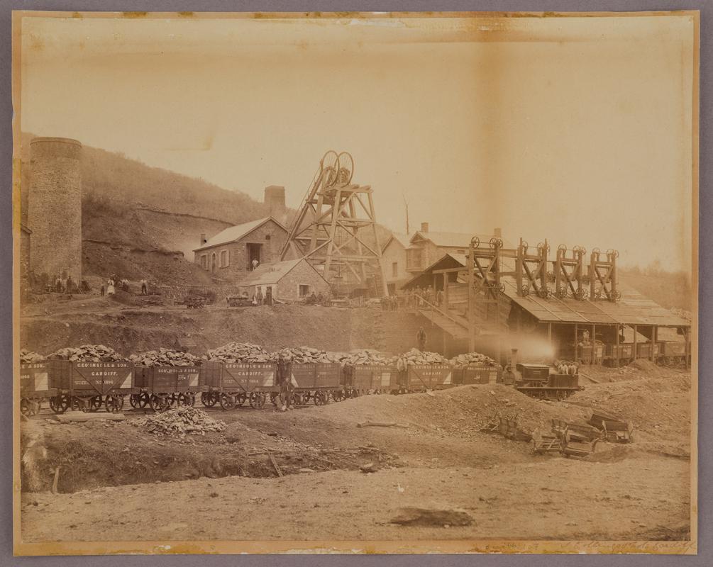 General view of an unidentified colliery in east Glamorgan, c.1880-1890. Shows headgear and lines of George Insole & Son coal wagons.