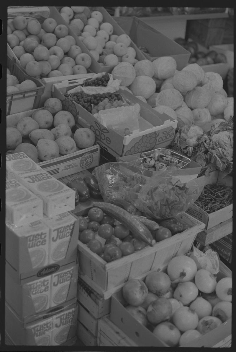 Boxes of fruit and vegetables in supermarket, Loudoun Square, Butetown.