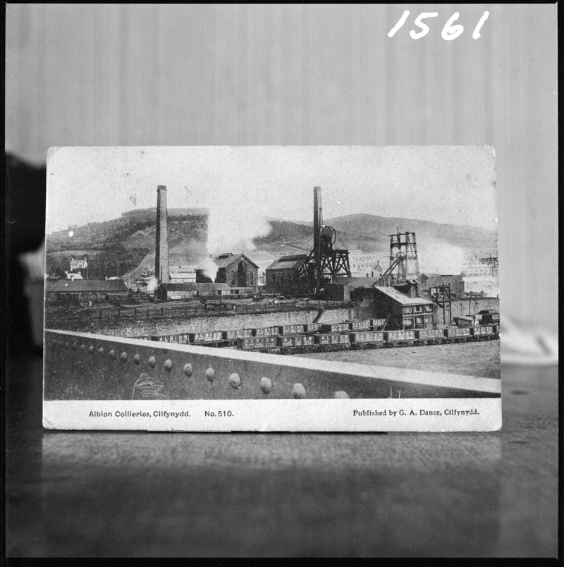 Black and white film negative of a postcard? showing a general surface view of Albion Colliery.  Bottom of postcard reads 'Albion Collieries, Cilfynydd'.  'Albion' is transcribed from original negative bag.