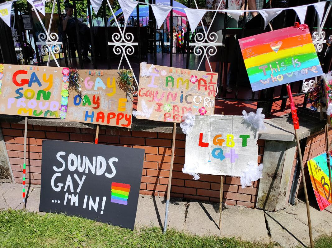 Digital photograph showing placards that had been carried during the parade at the first Powys Pride, Llandrindod Wells, Saturday 16 July 2022.