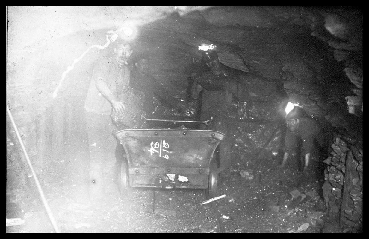 Three colliers at work underground in Coed Cae Pit, Lewis Merthyr Colliery.