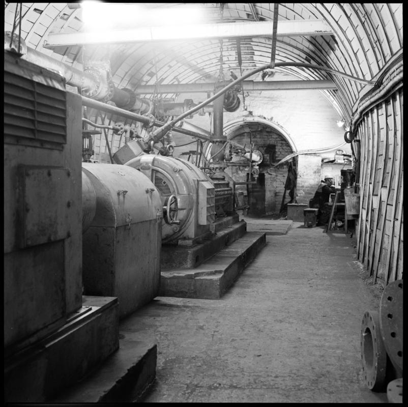 Black and white film negative showing an underground pumping station? at Merthyr Vale Colliery.  'Merthyr Vale' is transcribed from original negative bag.