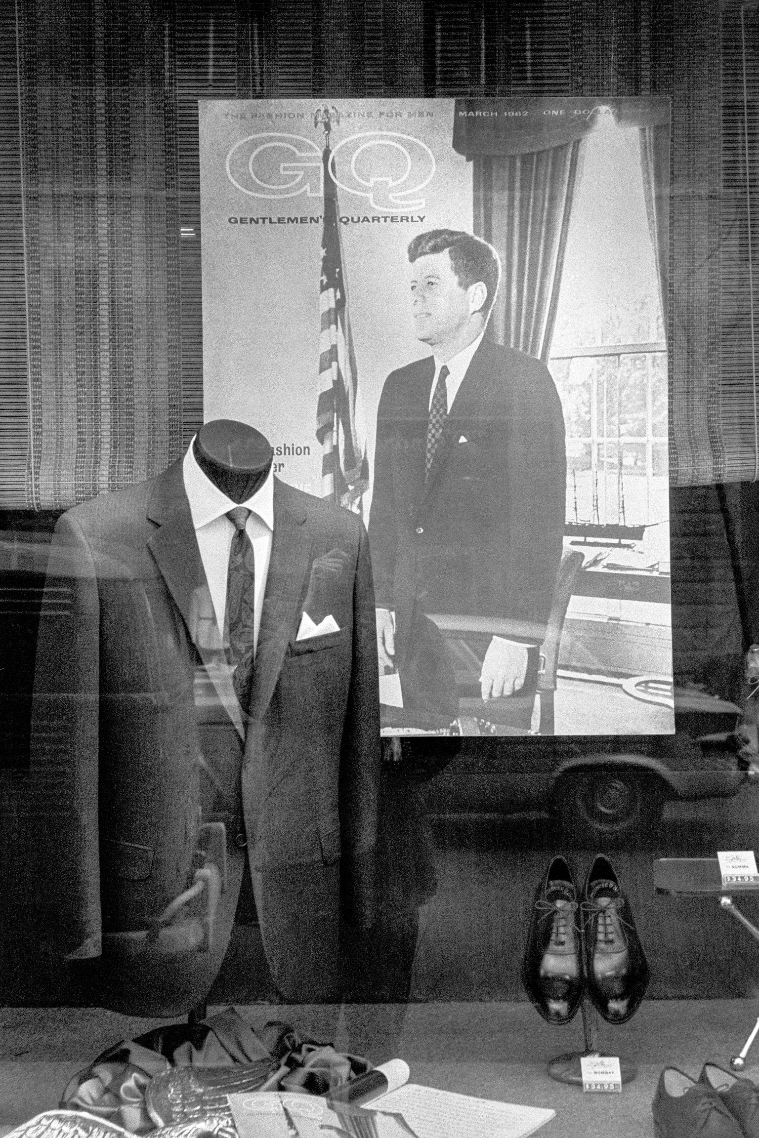Clothes shop window. President Kennedy as add and Flag. Lower Manhattan. New York USA