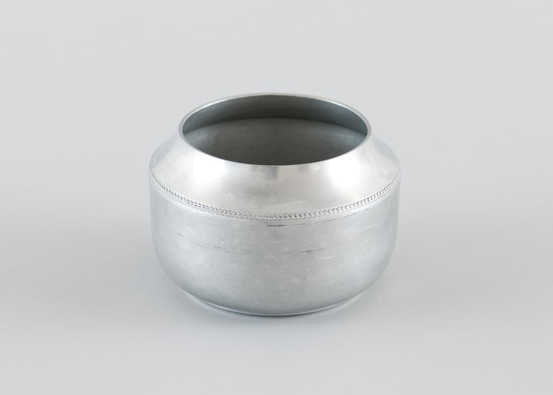 Aluminium circular sugar bowl, with chain design around upper edge.