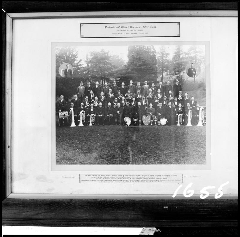 Black and white film negative of a framed photograph showing 'Treharris and District Workmen's Silver Band, winners of 22 first prizes.  Year 1922'.  Appears to be identical to 2009.3/3055.