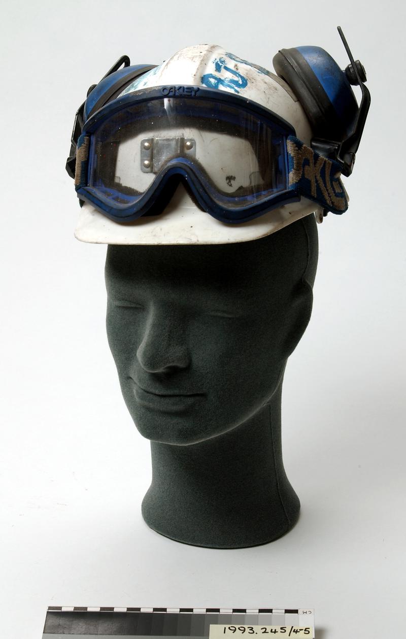White plastic miner's helmet with attached ear defenders