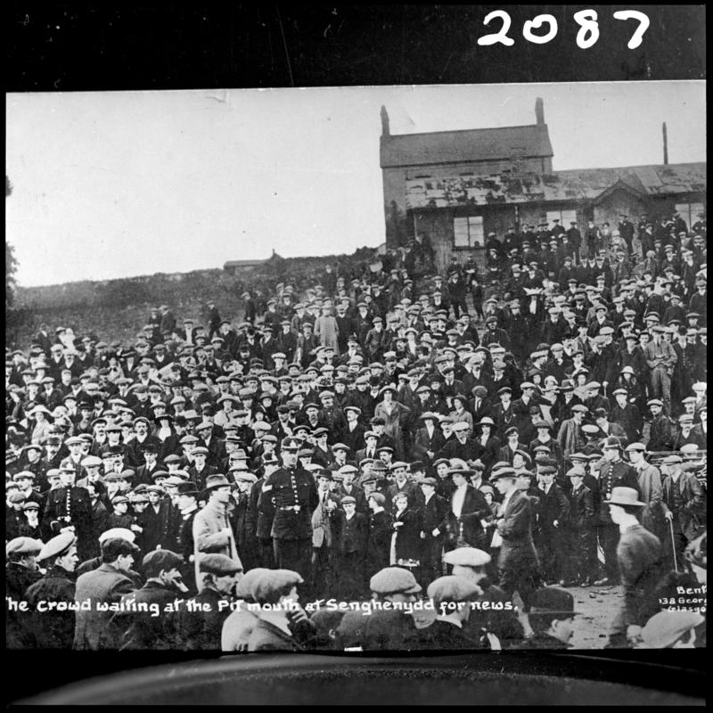 Black and white film negative of a photograph showing the scene at Universal Colliery, Senghenydd after the explosion of 14 October 1913.  Caption on photograph reads 'the crowd waiting at the pit mouth at Senghenydd for news'.