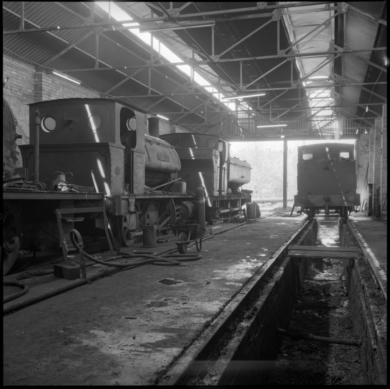 Black and white film negative showing locomotives inside Mountain Ash locomotive shed, Nixon's Navigation Colliery 19 May 1977.  '19 May 1977' is transcribed from original negative bag.