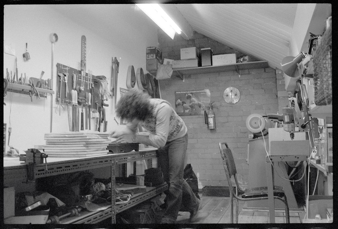 Craftsman working at bench.