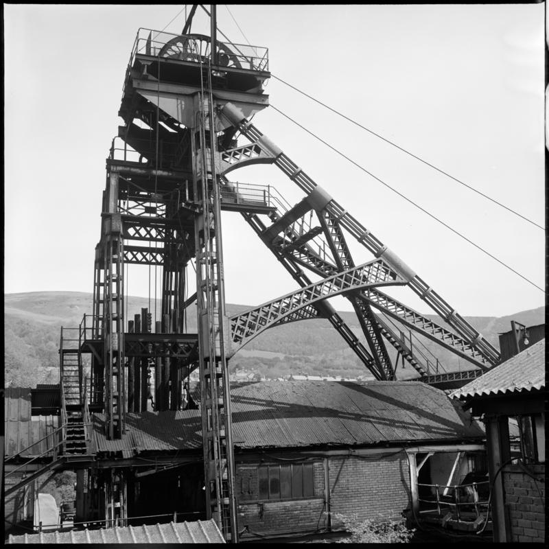 Black and white film negative showing a view of the headframe, Deep Duffryn Colliery 1977. 'Deep Duffryn 1977' is transcribed from original negative bag.