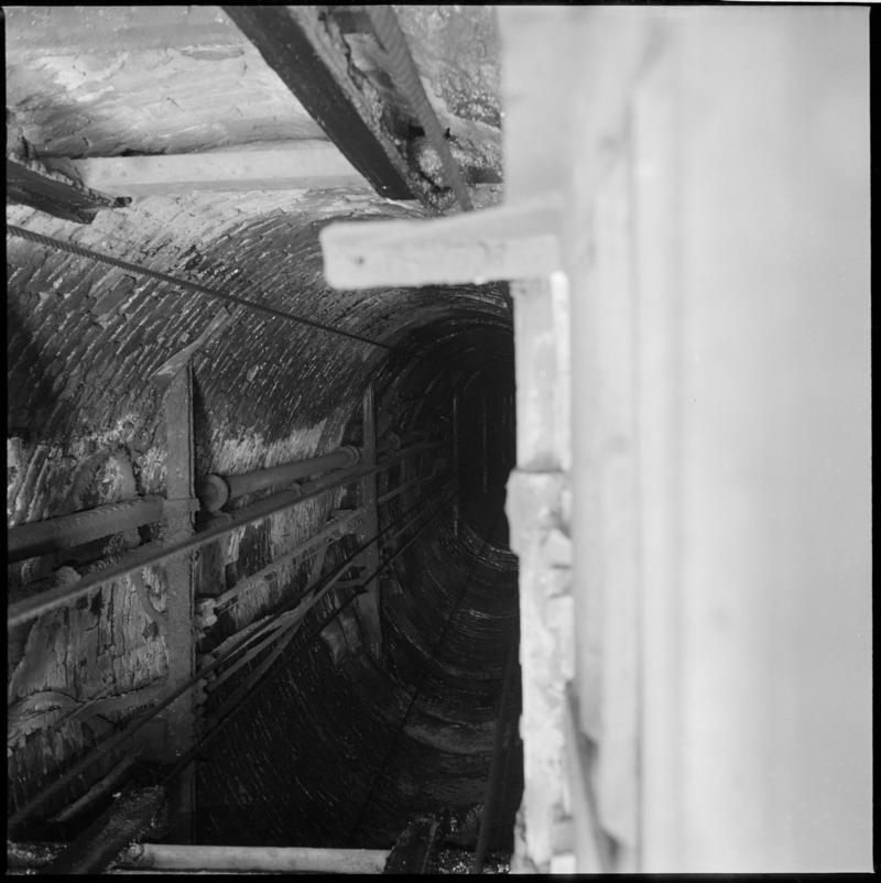 Black and white film negative showing inside the shaft, Big Pit Colliery, 22 August 1975.  'Shaft Blaenavon 22 Aug 1975' is transcribed from original negative bag.