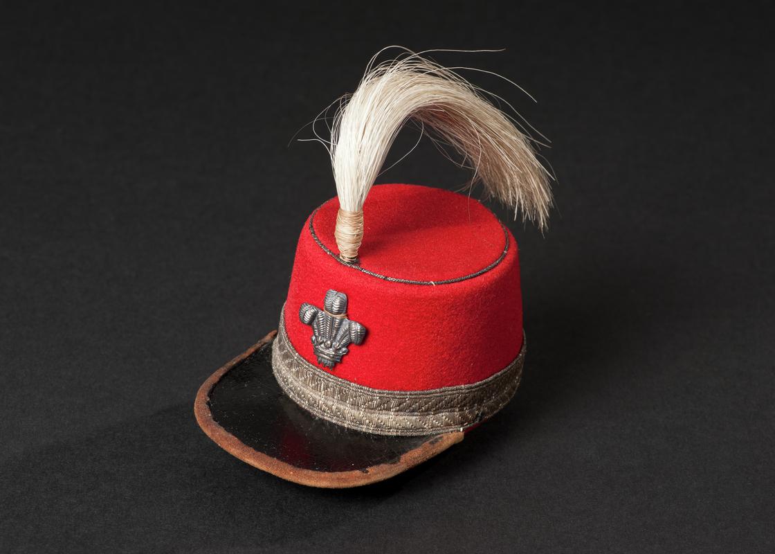 A collection of miniature hats made by John Evans