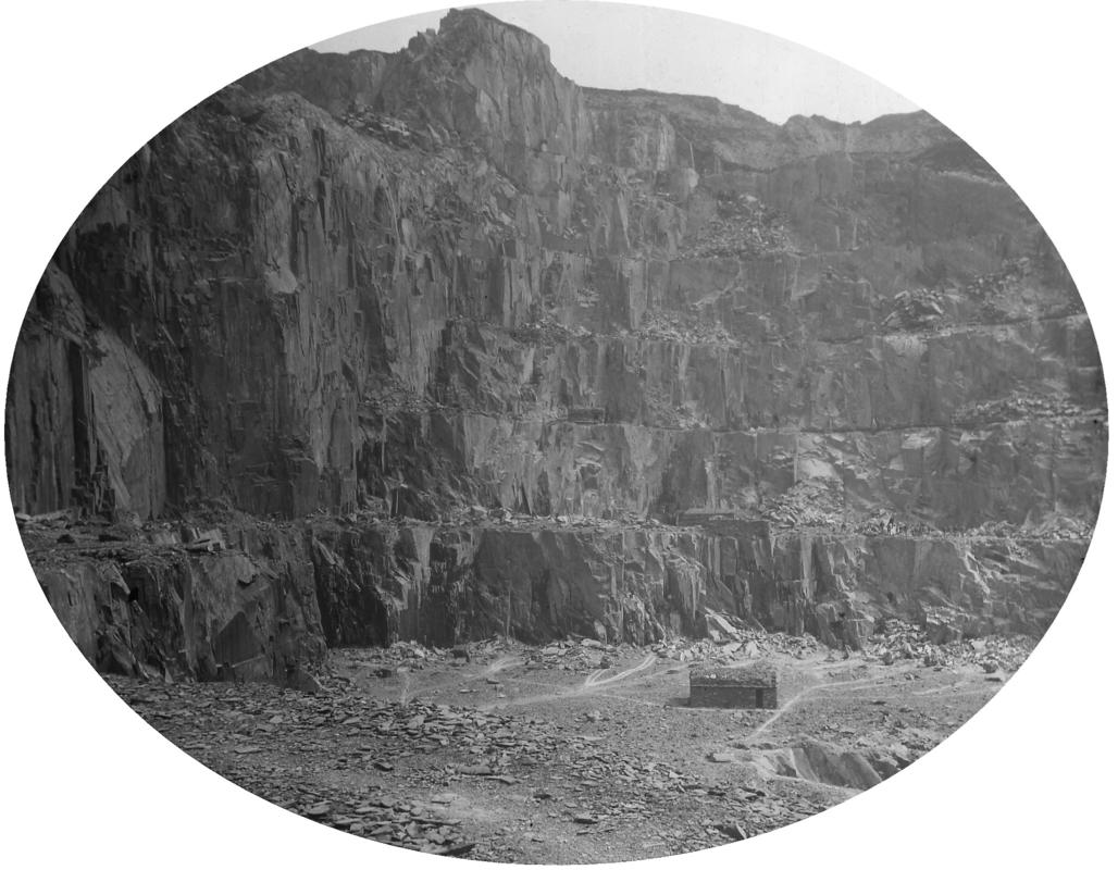 General view of the galleries at Dinorwic Quarry, with a 'cwt mochal ffiar' (a circular shelter to protect the workers during rock blasting) in the foreground