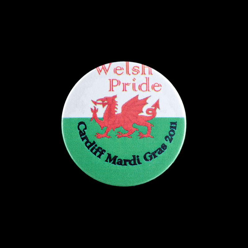 Badge 'Welsh Pride Cardiff Mardi Gras 2011'.
