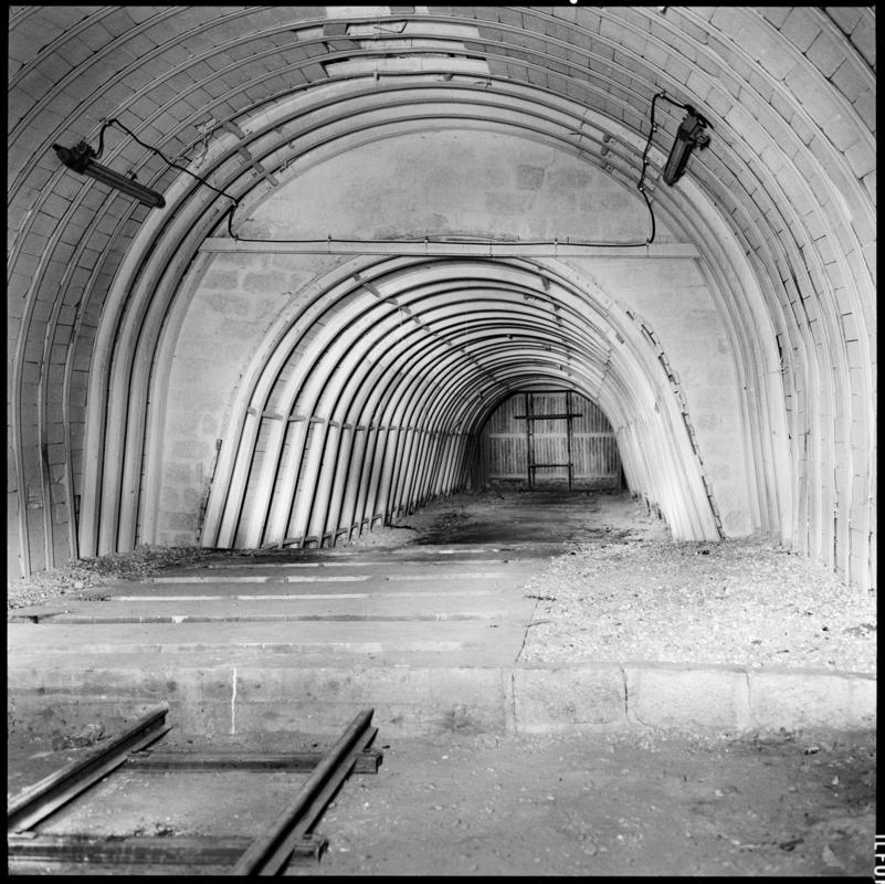 Black and white film negative showing a cleared roadway, underground at Merthyr Vale Colliery.
