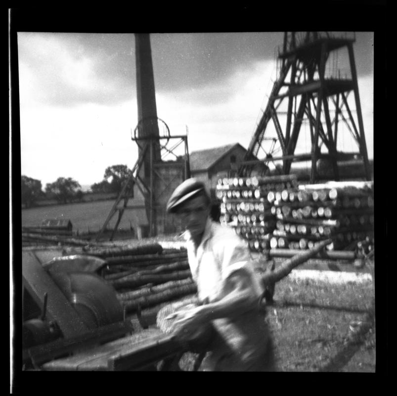 Unidentified colliery (possibly Brymbo colliery). Possibly shows the sawing of pit props.