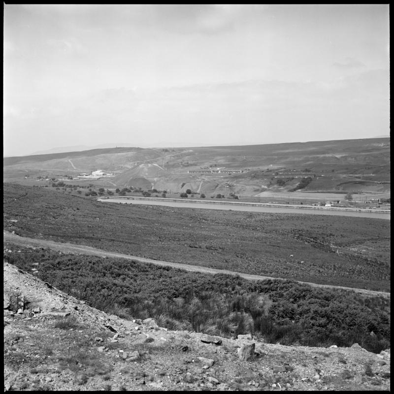 Black and white film negative showing the site of the washery tip, Big Pit Colliery.  'site of washery tip, Blaenavon' is transcribed from original negative bag.