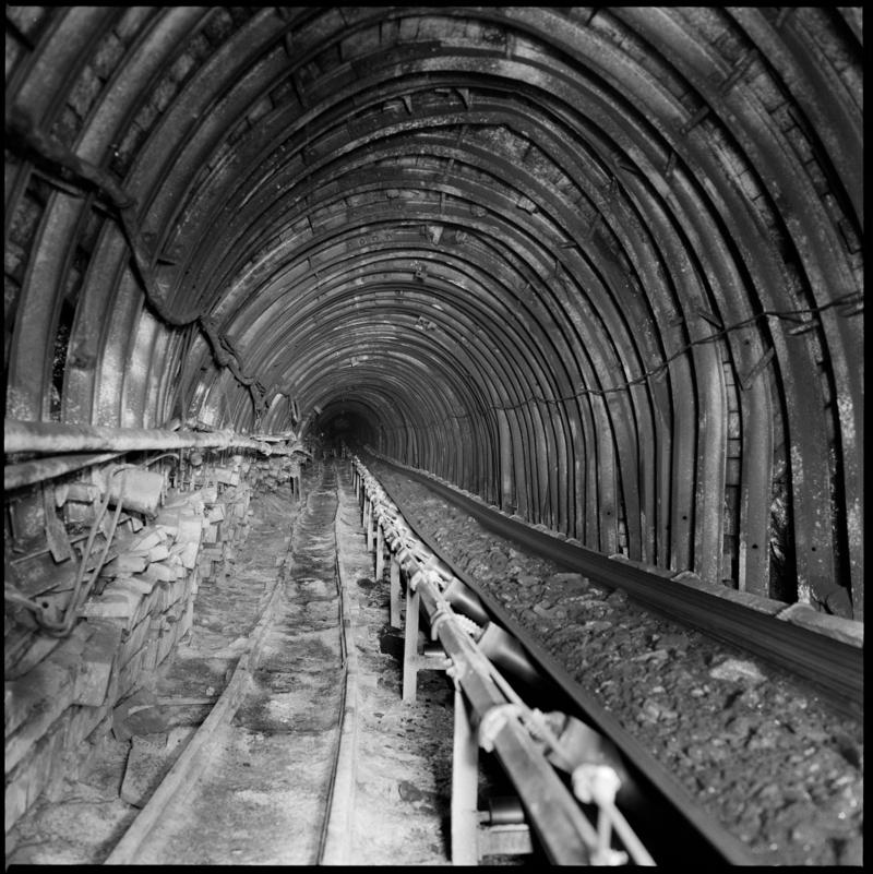 Colour film negative showing a high speed conveyor underground at Cwm Colliery.  'Cwm' is transcribed from original negative bag.