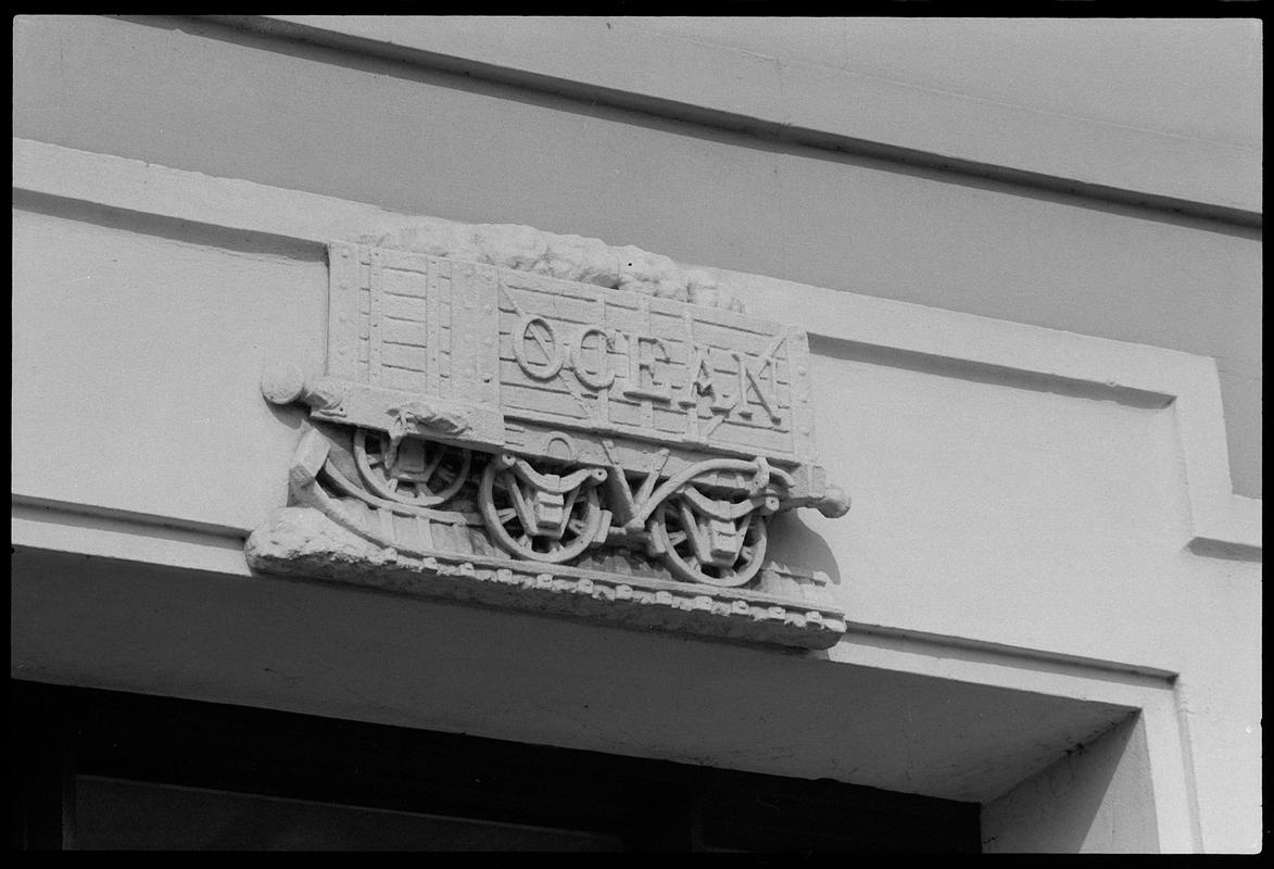 Coal wagon frieze, bearing the name "Ocean" (depicted in stone), on Ocean Buildings, Butetown.