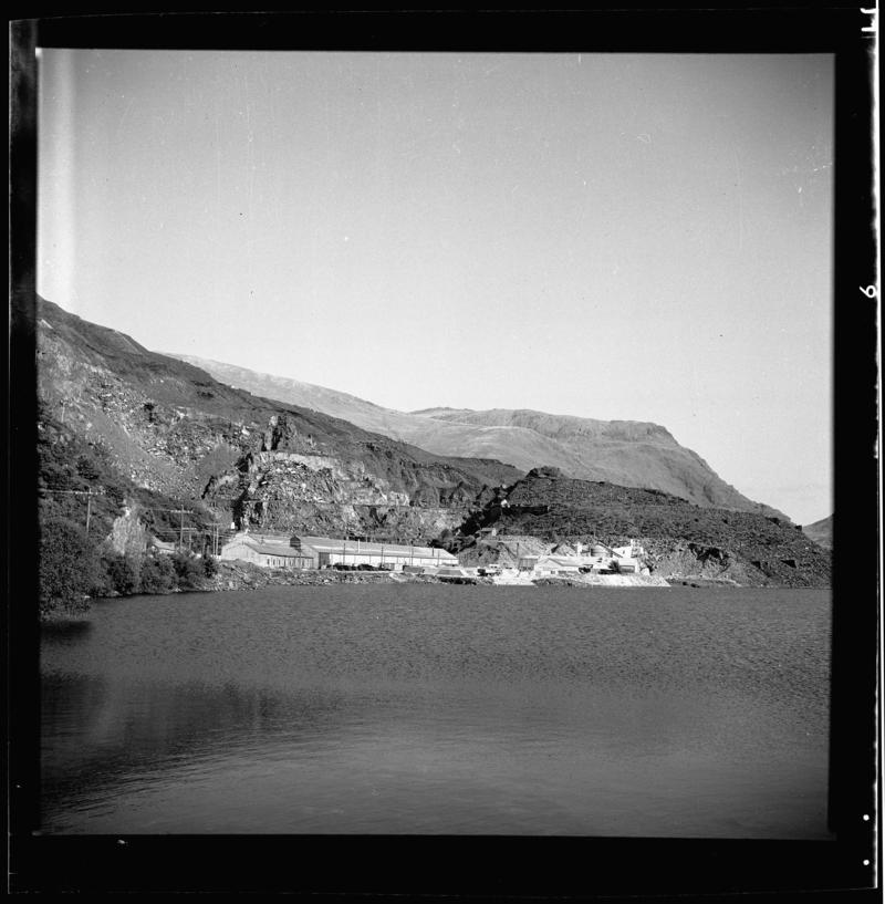General view of Dinorwig Quarry, 1950.

Image shows the 'Wellington' section of Dinorwig Quarry, with the Muriau Shed in the foreground, and the Ceiliog Mawr in the background.  Photograph taken from 'Pont Bala'.