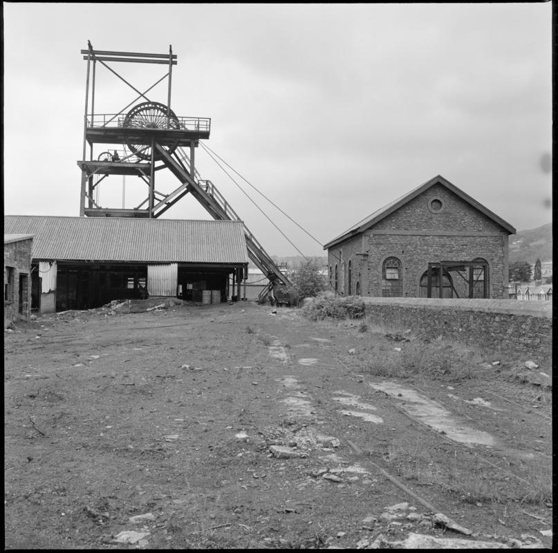 Black and white film negative showing the headframe and engine house of the South Pit, Nixon's Navigation Colliery 1975.  'Mountain Ash 1975' is transcribed from original negative bag.
