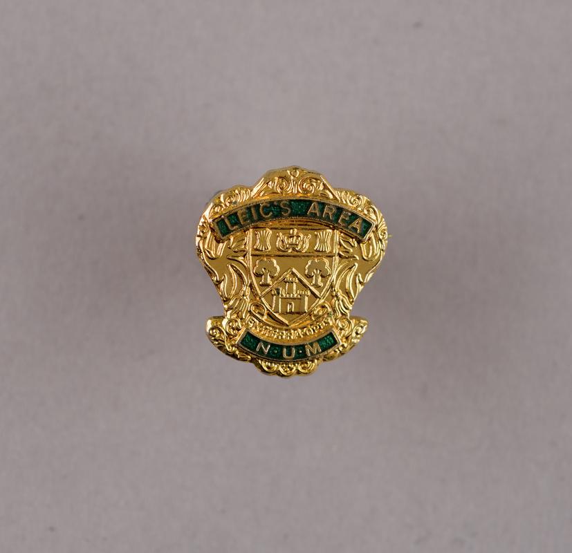 Leic's Area N.U.M., badge