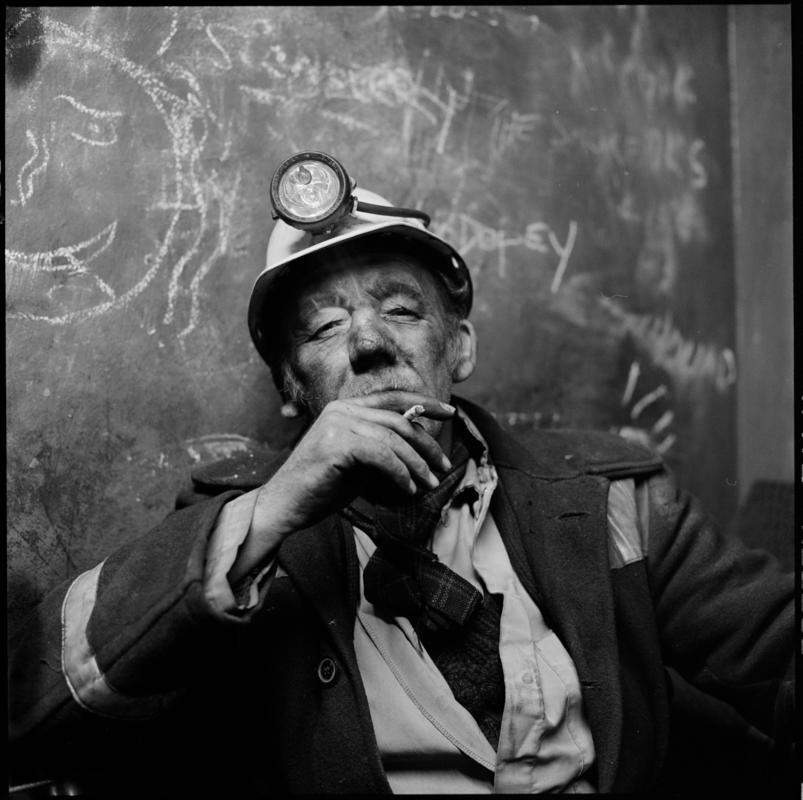 Black and white film negative showing a miner on break, Coegnant Colliery 25 November 1981.  '25 Nov 1981' is transcribed from original negative bag.
