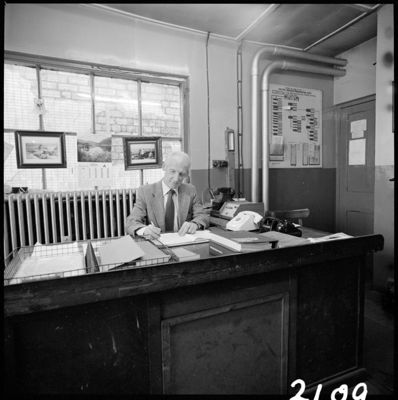 Black and white film negative showing Glyn Morgan, the final NCB manager, in his office at Big Pit Colliery, 28 November 1980.  'Blaenavon 28/11/80 Glyn Morgan' is transcribed from original negative bag.