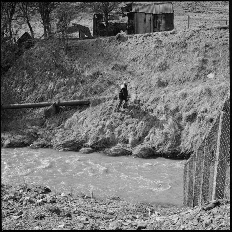 Black and white film negative showing a man walking up a slope, Big Pit Colliery.  'Blaenavon' is transcribed from original negative bag.