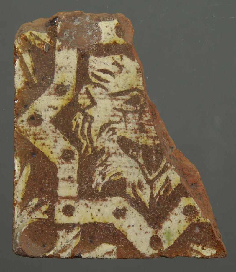 floor tile with lion mask in centre