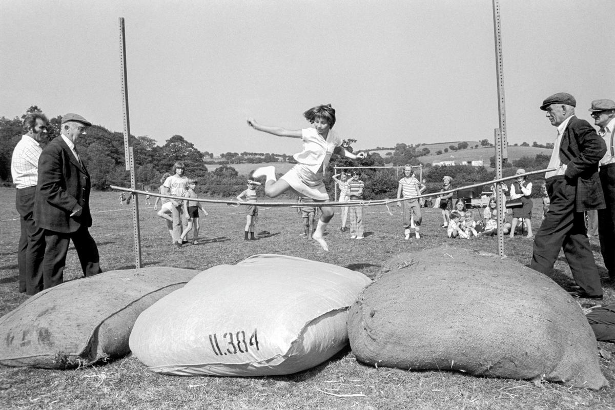 GB. WALES. Upper Chapel. The high jump at the children's sports day at Upper Chapel in Mid Wales. 1976