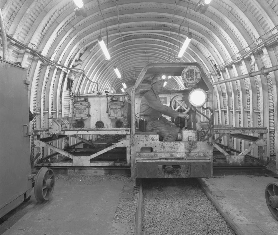 Black and white film negative showing an electric locomotive underground at Oakdale Colliery, May 1980.  'Oakdale May 1980' is transcribed from original negative bag.