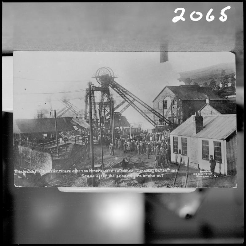 Black and white film negative of a photograph showing the scene at Universal Colliery, Senghenydd after the explosion of 14 October 1913.  Caption on photograph reads 'the Welsh pit disaster where over 400 miners were entombed.  Tuesday Oct 14th 1913.  Scene after the second explosion'.  'Senghenydd Disaster 1913' is transcribed from original negative bag.