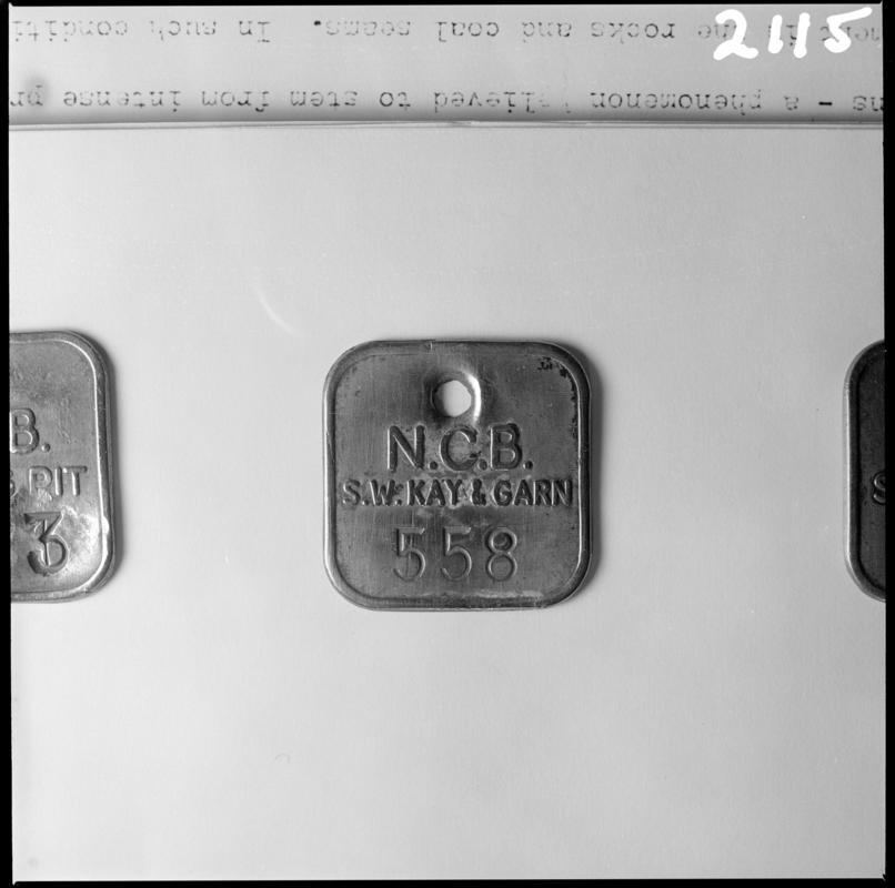 Black and white film negative showing a Blaenavon Co. Ltd. Garn and Kay's Slope lamp check, no.558.  'Blaenavon check Garn and Kays' is transcribed from original negative bag.