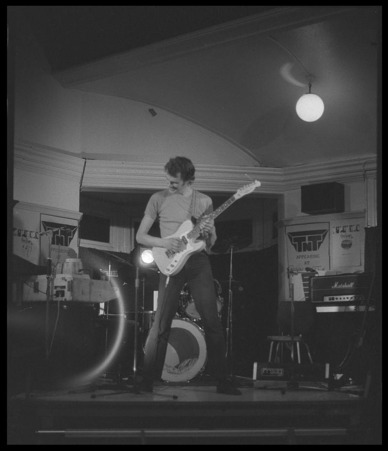 Guitar player, from TNT Group on stage. Location unknown.