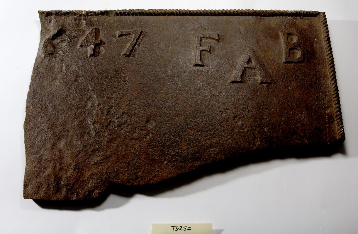 Cast iron fireback fragment