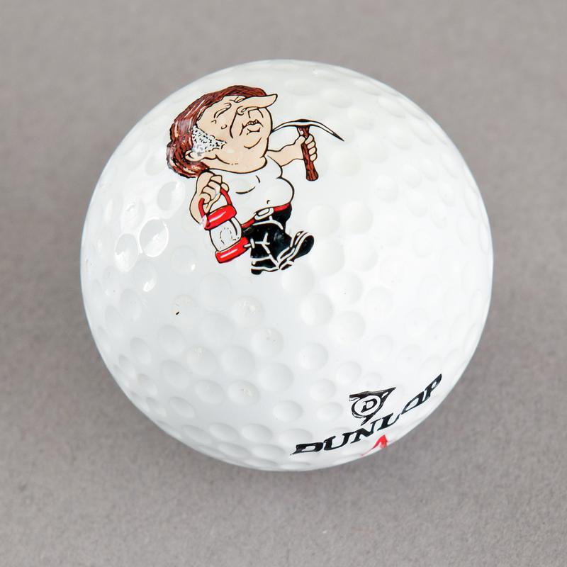 Golf ball with caricature of Arthur Scargill. Sold during 1984-85 Miners' Strike.