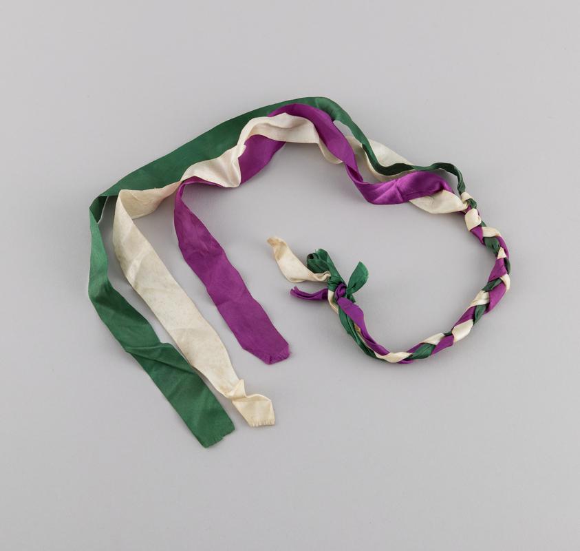 Purple, green and white ribbons worn by Thalia Campbell in her hair on the march from Cardiff to Greenham Common, 27 August - 5 September 1981.