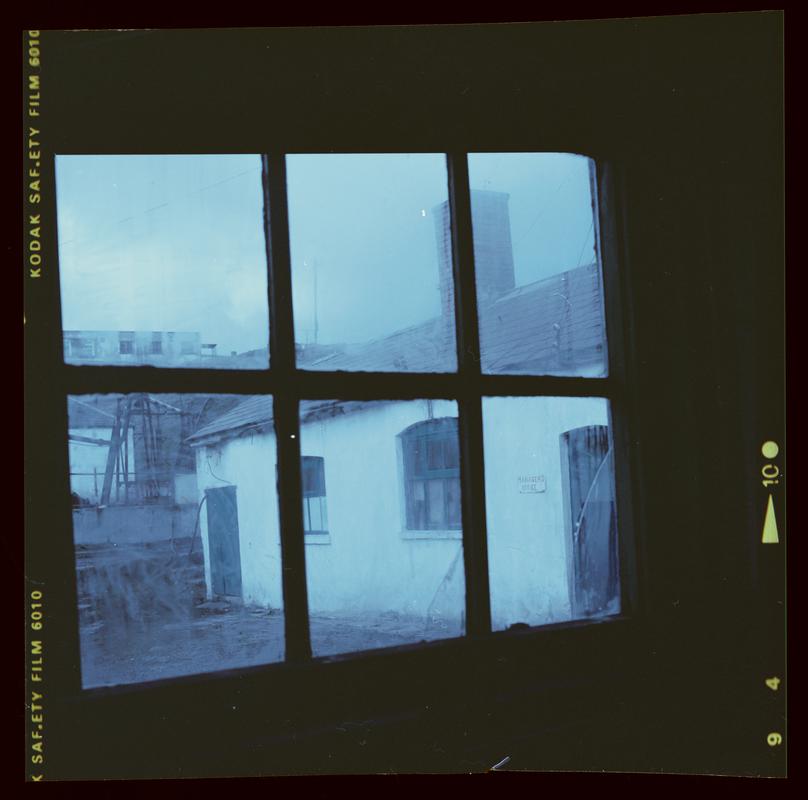 Colour film negative showing a view out of the manager's office window.