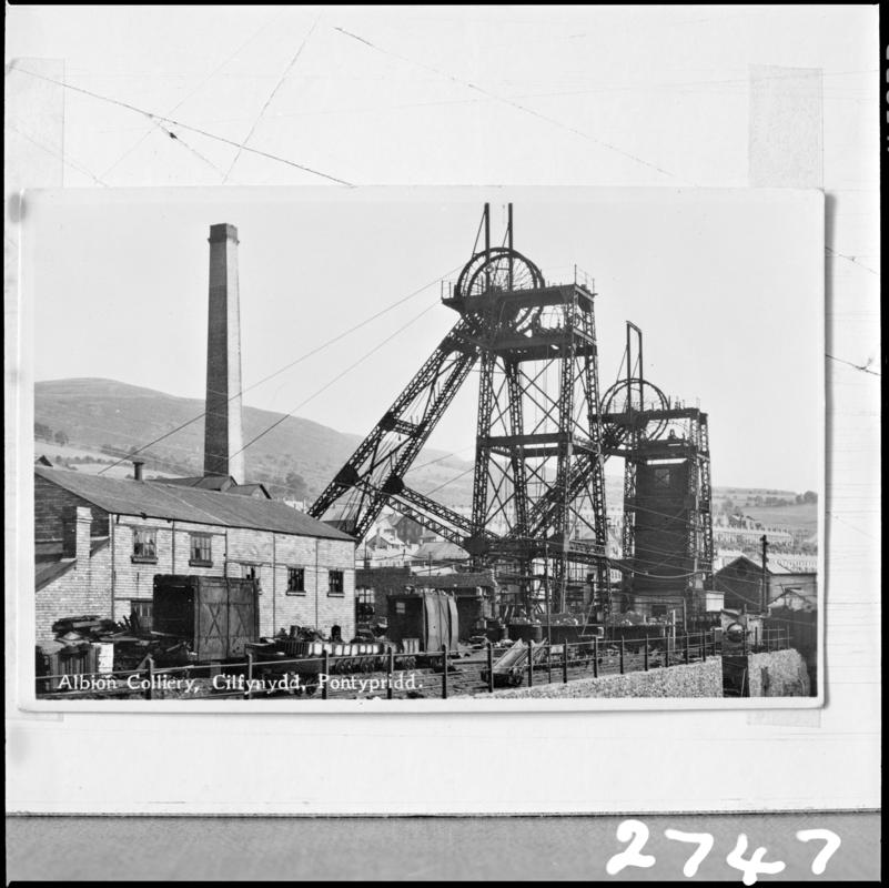 Black and white film negative of a photograph showing a surface view of Albion Colliery.  'Albion' is transcribed from original negative bag.