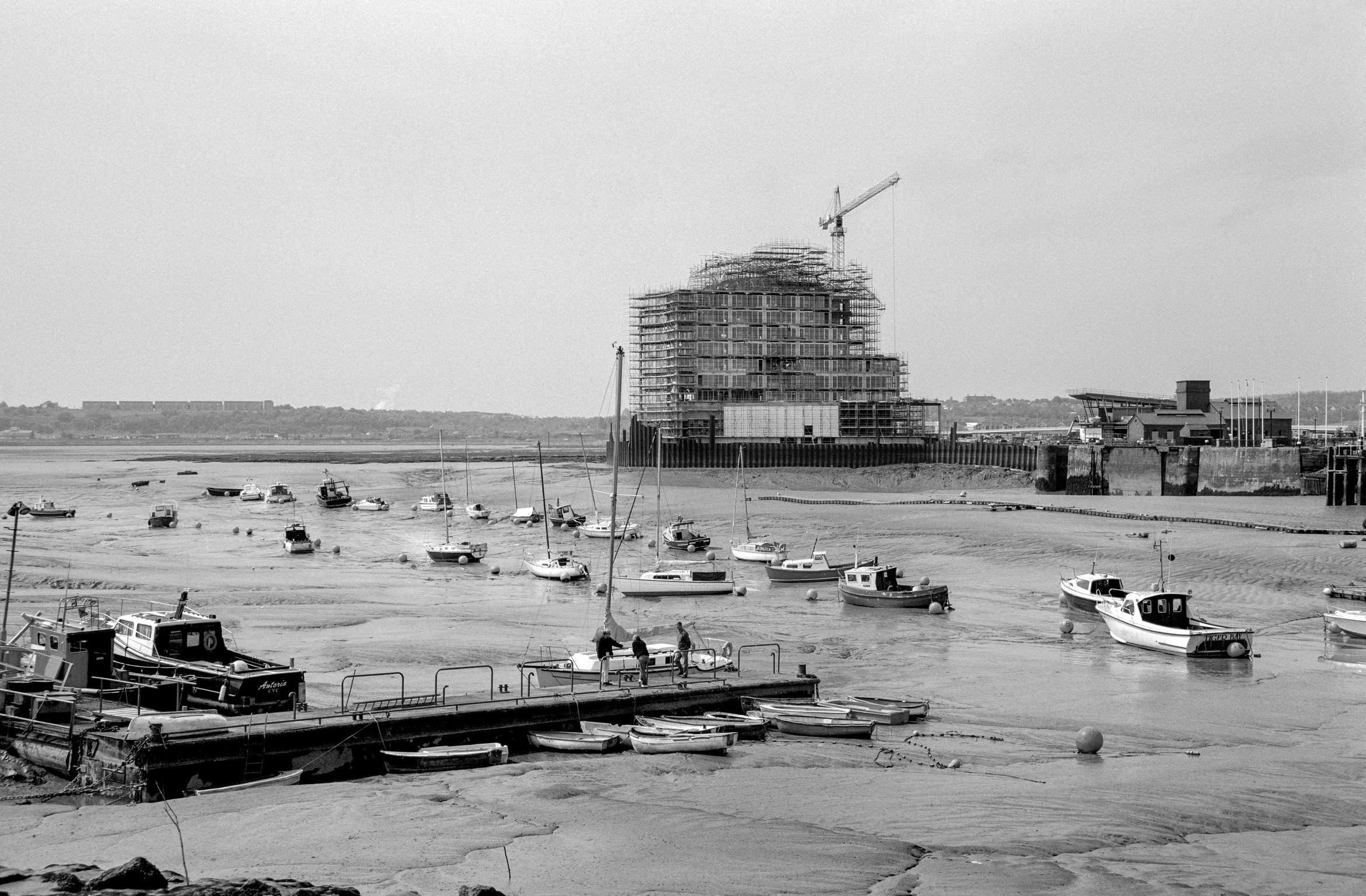 Mudflat view with the building of St David's Hotel & Spa in the distance. Cardiff, Wales