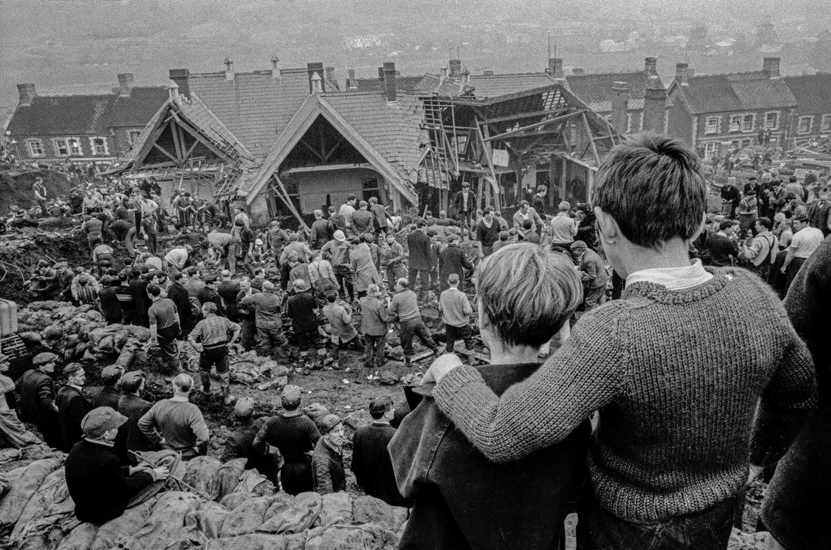 GB. WALES. Aberfan Coal Slip Disaster.  Two surviving children stand at the top of the hill overlooking the miners digging to find children still buried in the slag.  Over one hundred children in the apparent safety of their school were buried under the waste of a sliding coal tip. 1966.